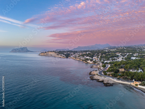 Aerial Mediterranean Coastline at Pink Sunset Over Coastal Moraira, Spain