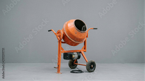 Fotografi Orange cement mixer for construction work