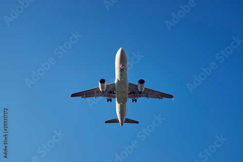 Passenger plane during landing, upward view