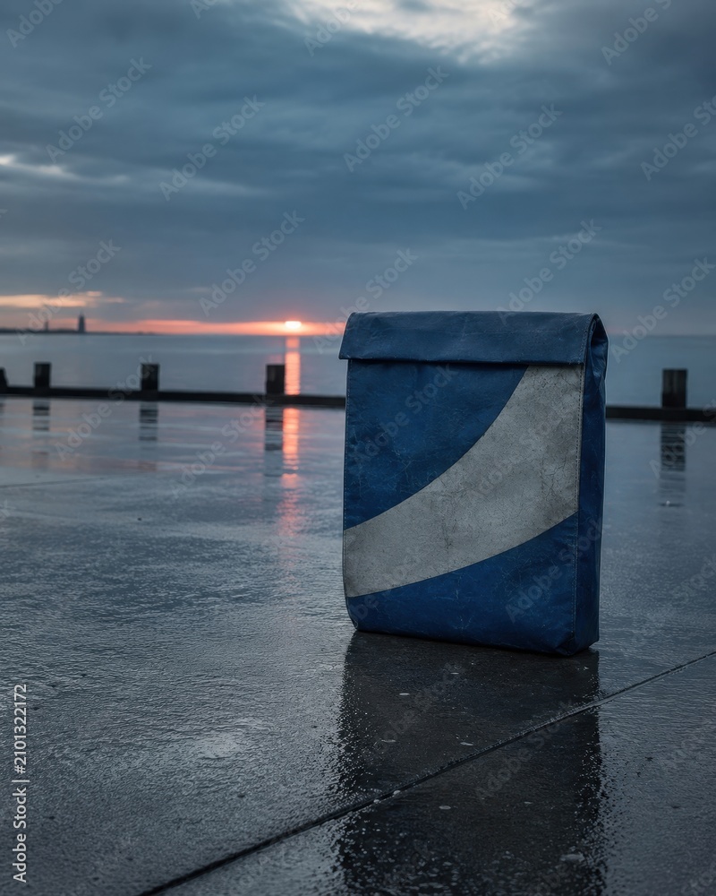 Fototapeta premium Solitary bag by the serene pier with calm wellness styling and soothing natural light