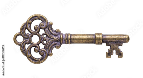 Fotografie Antique ornate brass key with intricate scrollwork and a detailed bit