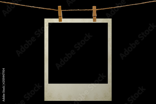 Blank photo frame hanging on a rope with a wooden clothespin. Isolated black JPEG mockup.