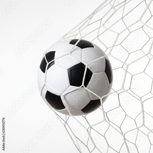 Soccer ball in goal net, close up shot on white background, representing success, achievement, and sports victory.