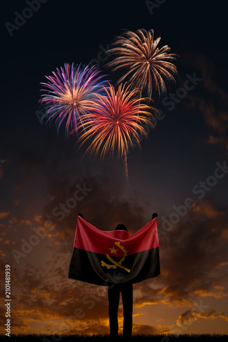 Girl with National flag of Angola on Independence day