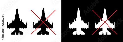 Silhouette of a military aircraft and the concept of a no-fly zone with the silhouette of a military fighter jet.