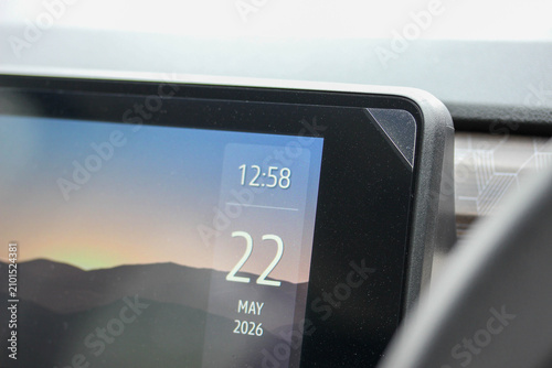 Close up of the protective film pull tab on a new vehicle media screen