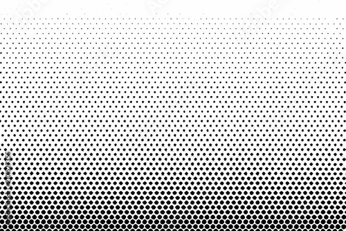 Obraz na płótnie Halftone gradient pattern with fading dots on a white background