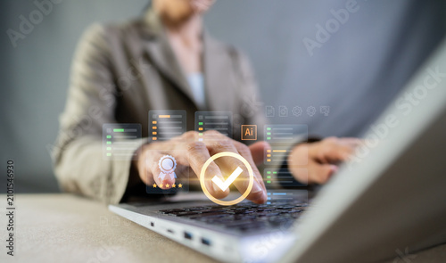 Obraz na płótnie Businesswoman using AI to check quality control, standard evaluation, and virtual checklist on laptop