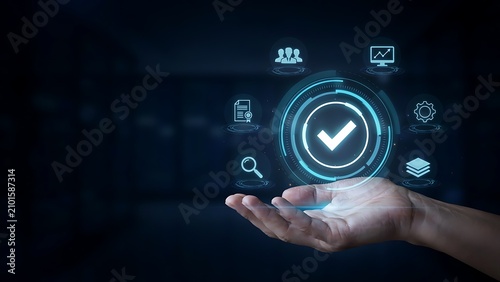 Human hand holding a glowing circular interface with a checkmark surrounded by symbols for documents, people, analytics, and settings