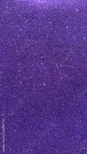 Deep purple glitter texture with reflective sparkle particles