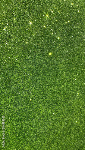 Bright green glitter texture with sparkling light reflections