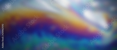 Fényképezés Finely granulated deep blue and gold oil-on-water refractions form abstract iridescent patterns under soft diffuse light
