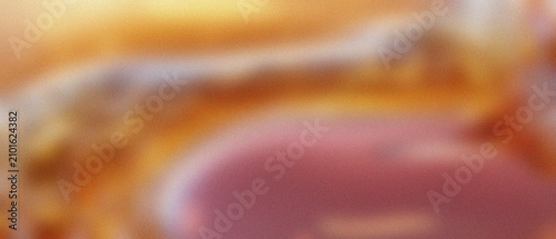 Foto Luminous abstract macro reveals syrupy crystallization, granular textures, and dissolving edges in a soft gradient of golden amber and rose-pink hues