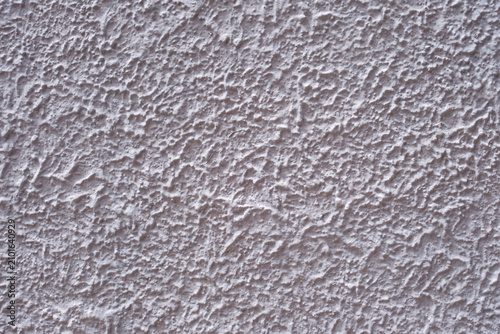 Fotografia White stucco wall providing a rough textured background