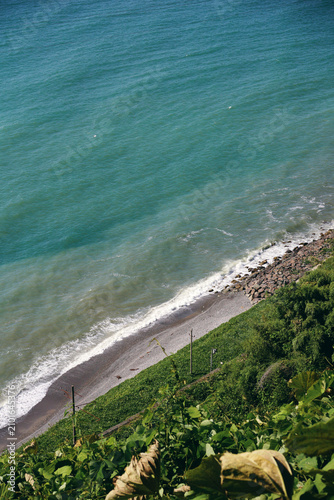 a view of the sea and the waves crashing against the shore