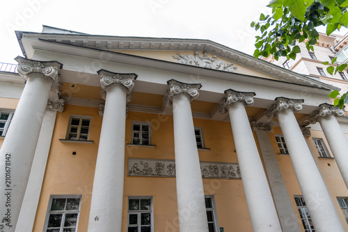 Fotografie Classical yellow facade of the historic Khitrovo Manor with Ionic columns in Mos