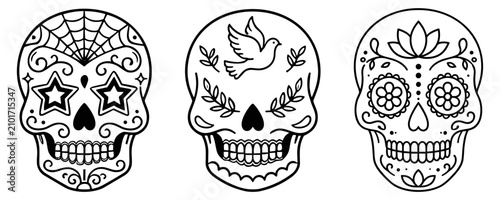 Foto Set of three black and white sugar skull illustrations with decorative patterns