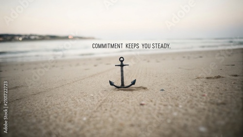 Tranquil Beach Scene Featuring a Solitary Anchor Symbolizing Commitment and Stability on Sandy Shoreline