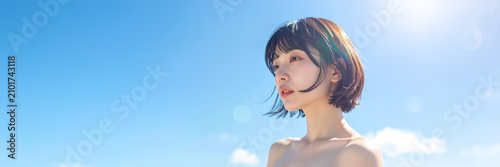 夏を感じさせる屋外撮影の若い日本人女性美容ポートレート
