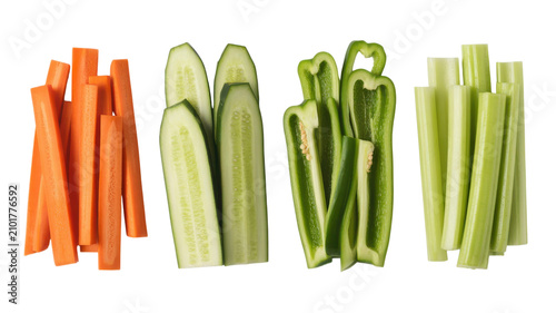 Healthy fresh vegetable sticks with carrots cucumber bell pepper celery on transparent set.