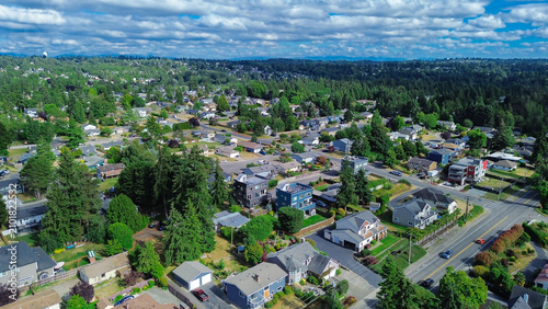 Residential street networks weave through mature woodland patches in residential pockets near Zenith. Local housing architecture sits amidst varying tree canopy cover found across Des Moines, WA