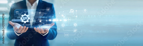 Fotografía Software engineer handhold virtual screen for API integration while working on laptop to connect services