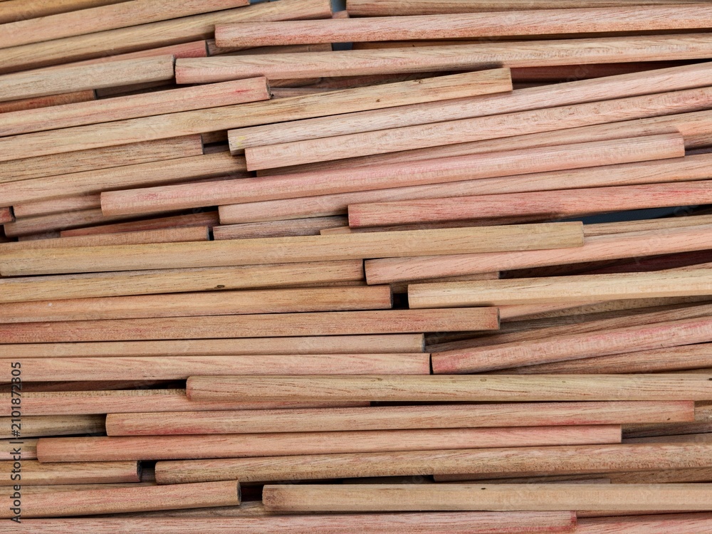 Obraz premium Densely layered natural wood sticks create a unique and messy organic linear pattern full of rustic texture. For Industrial background