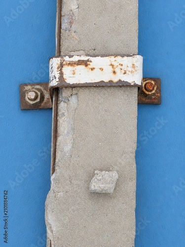 Konstfotografi Minimalist abstract photography of industrial concrete pole with rusty metal cla