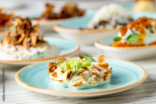 Photos Creamy fava bean puree topped with toasted almonds and dill