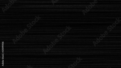 Dark black brushed metal texture with horizontal lines and subtle metallic grain for industrial design backgrounds and modern luxury surface patterns