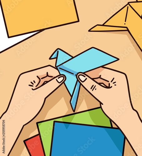Hands Folding Origami Bird