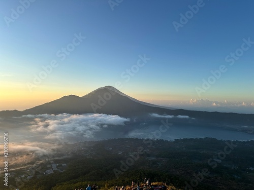 Fotografie View of Mount Agung with sea of clouds at sunrise from Mount Batur, Bali, Indone