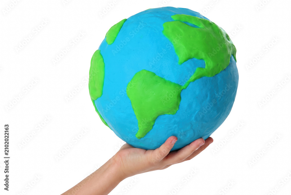 Ταπετσαρία Hand holding a clay model of the earth globe showing the Americas