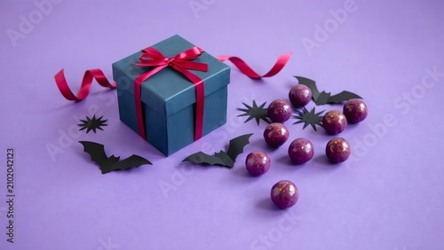 Halloween gift box with purple candy and decorations