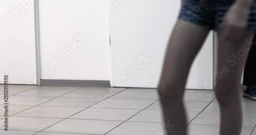 leaving a doctor's appointment at a modern medical facility.