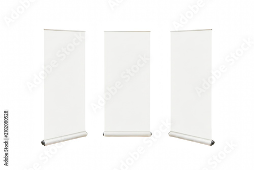 Trio of white vertical roll up banner stands for exhibition