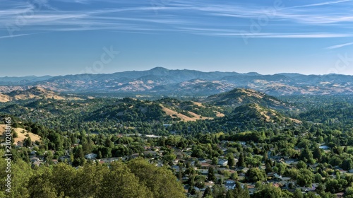 Elevated perspective revealing rolling hills and mountain horizon above Walnut Creek