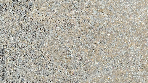 Foto Fine gravel and sand ground texture background with small crushed grey stones