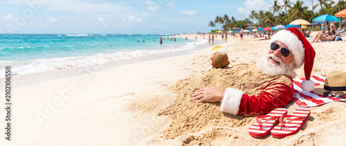 Santa vacation on the beach. Christmas in July