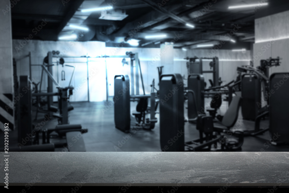 Fototapeta premium Empty stone surface in modern gym, selective focus. Space for design