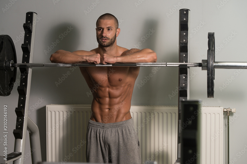Fototapeta premium Attractive Young Man Resting Relaxed In Gym