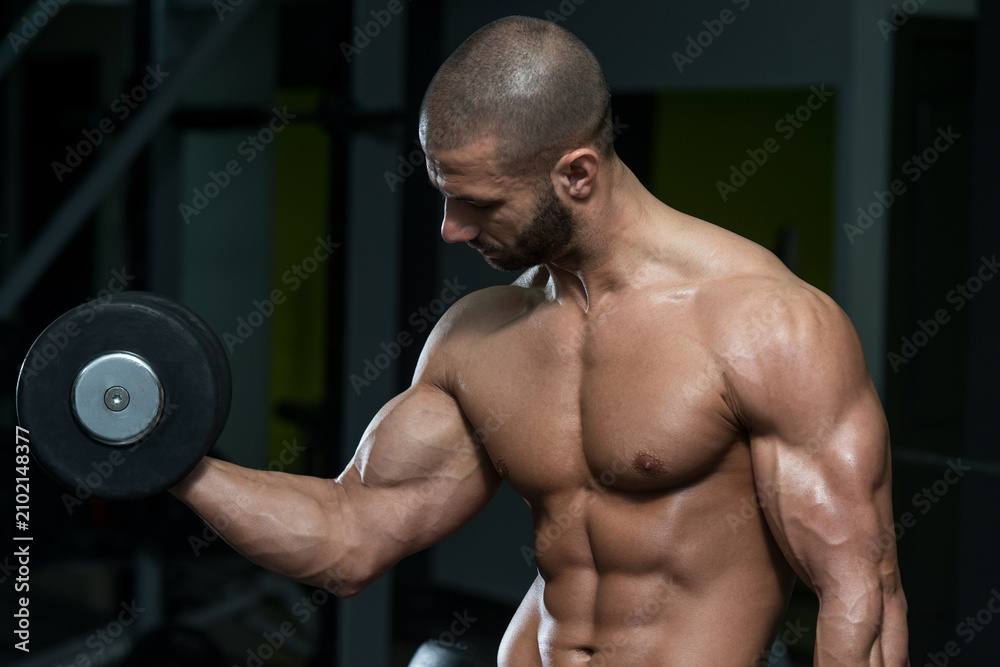 Fototapeta premium Bodybuilder Exercise With Dumbbells