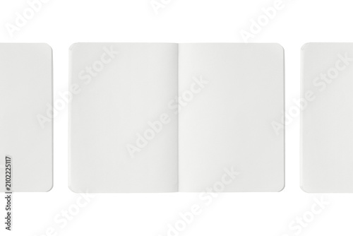 Three open white notebooks with rounded corners side by side.