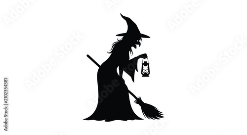 Photos Silhouette of Witch Flying on Broomstick Holding Lantern.