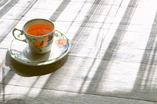Tableau sur toile Morning Tea by the Window with Sunlight and Shadows
