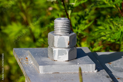 Canvastavla Close-up of a heavy-duty industrial steel bolt and nut fastening a high-voltage