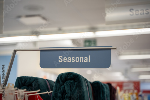 Close up of seasonal section sign inside a retail store.