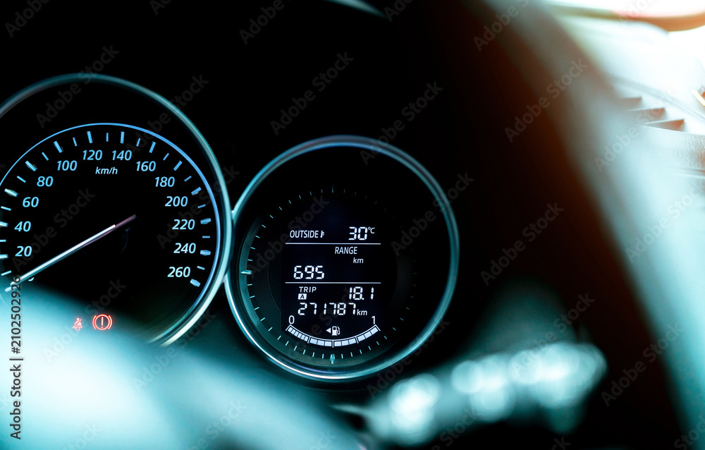 Naklejka premium Closeup car fuel gauge dashboard panel. Gasoline indicator meter and speedometer. Fuel gauge show full gas tank. Data information dashboard show outside car temperature, trip range and fuel tank icon.