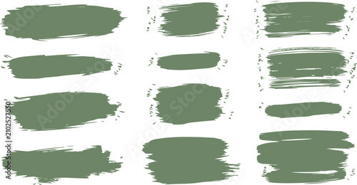 A collection of textured green paint brush strokes, thick ink swatches, and distressed paint streaks isolated on a white background.
