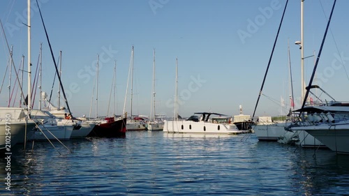 Modern yachts docked in coastal marina